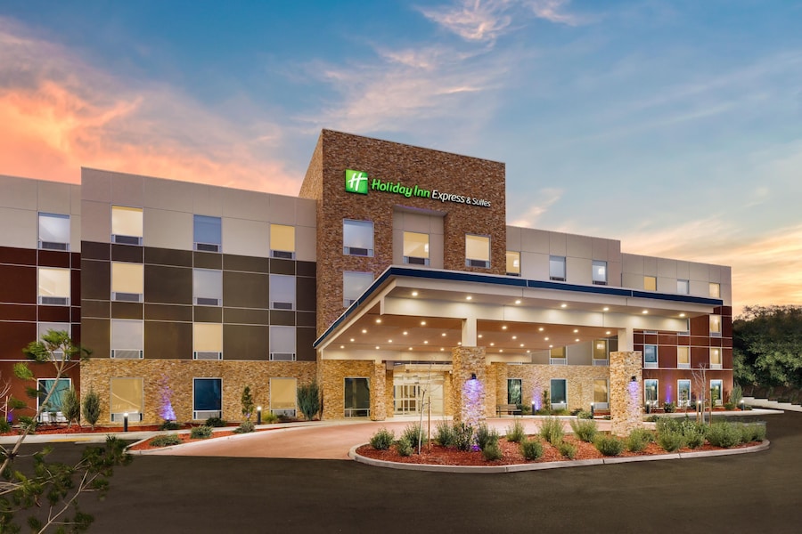 A Holiday Inn Express building with a modern design, featuring a stone facade and a covered entrance. - Holiday Inn Express & Suites Oakhurst - Yosemite Park Area by IHG (Oakhurst)